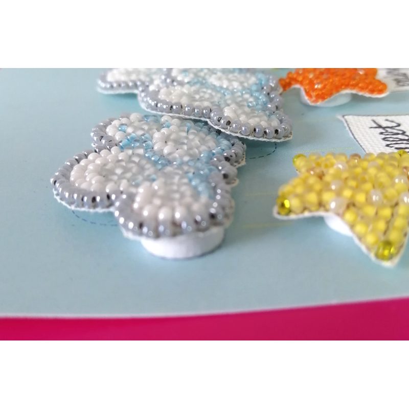 Keychain cross-stitch kit Among stars and clouds